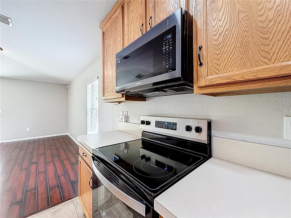 6358 Southwest 155th Place Ocala, FL 34473 - Photo 20 of 55 a stove top oven sitting inside of a kitchen