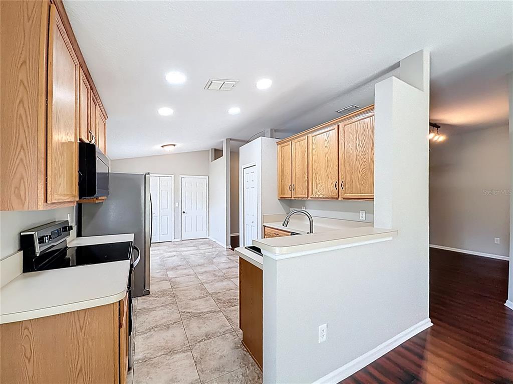 6358 Southwest 155th Place Ocala, FL 34473 - Photo 24 of 55 a view of a kitchen with a sink and a large window