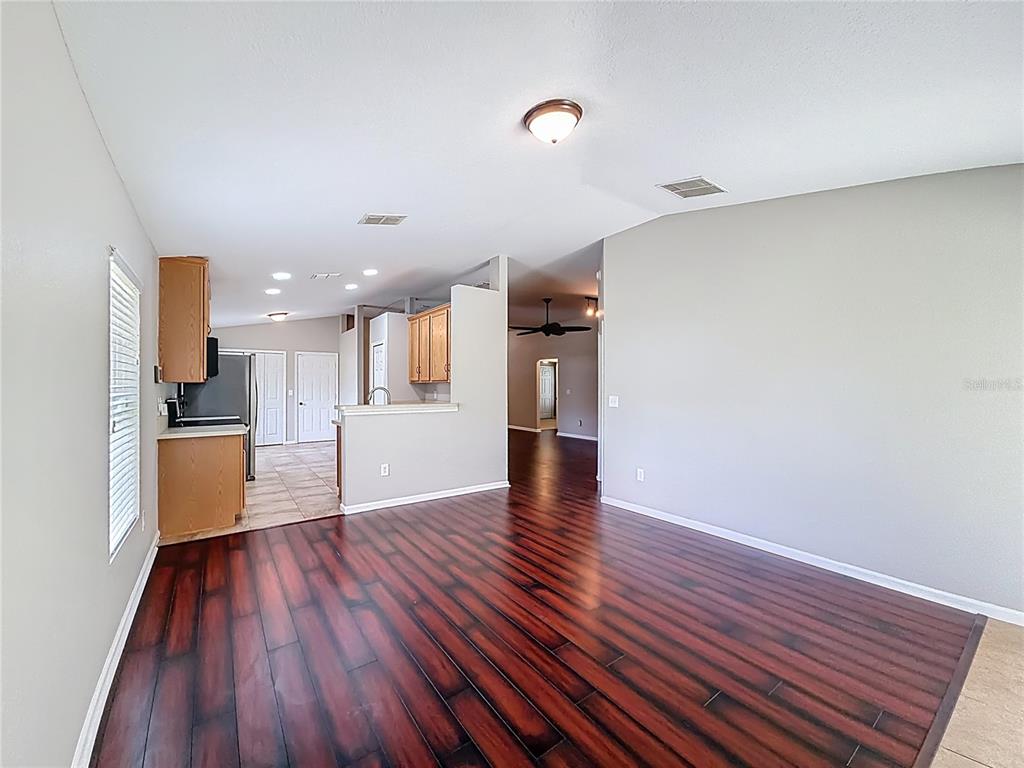 6358 Southwest 155th Place Ocala, FL 34473 - Photo 26 of 55 a view of kitchen with cabinets and wooden floor