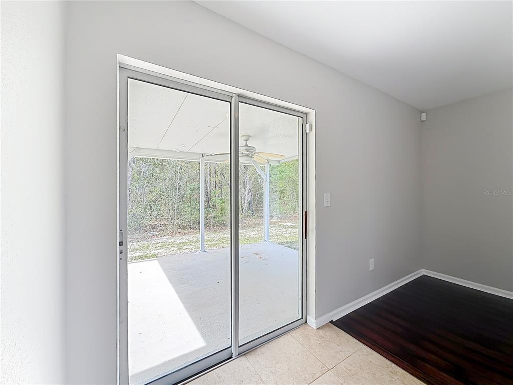 6358 Southwest 155th Place Ocala, FL 34473 - Photo 29 of 55 a view of an empty room and wooden floor