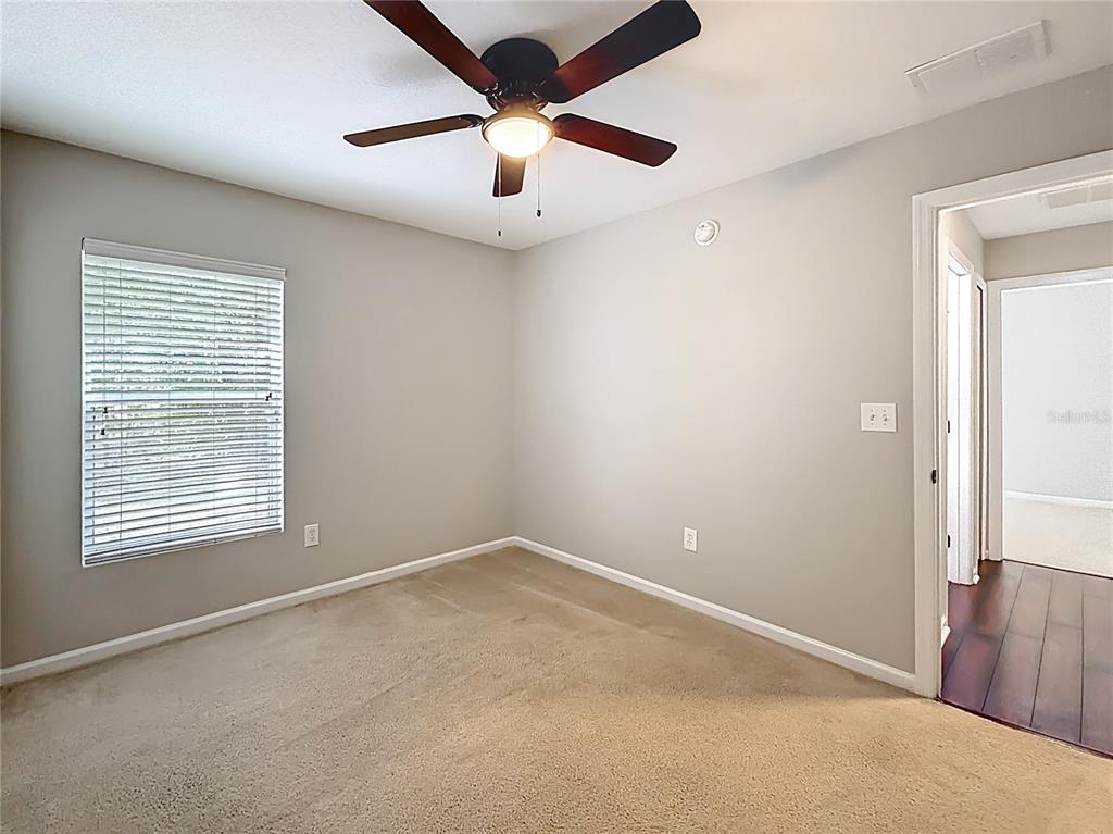 6358 Southwest 155th Place Ocala, FL 34473 - Photo 32 of 55 an empty room with a window and a fan