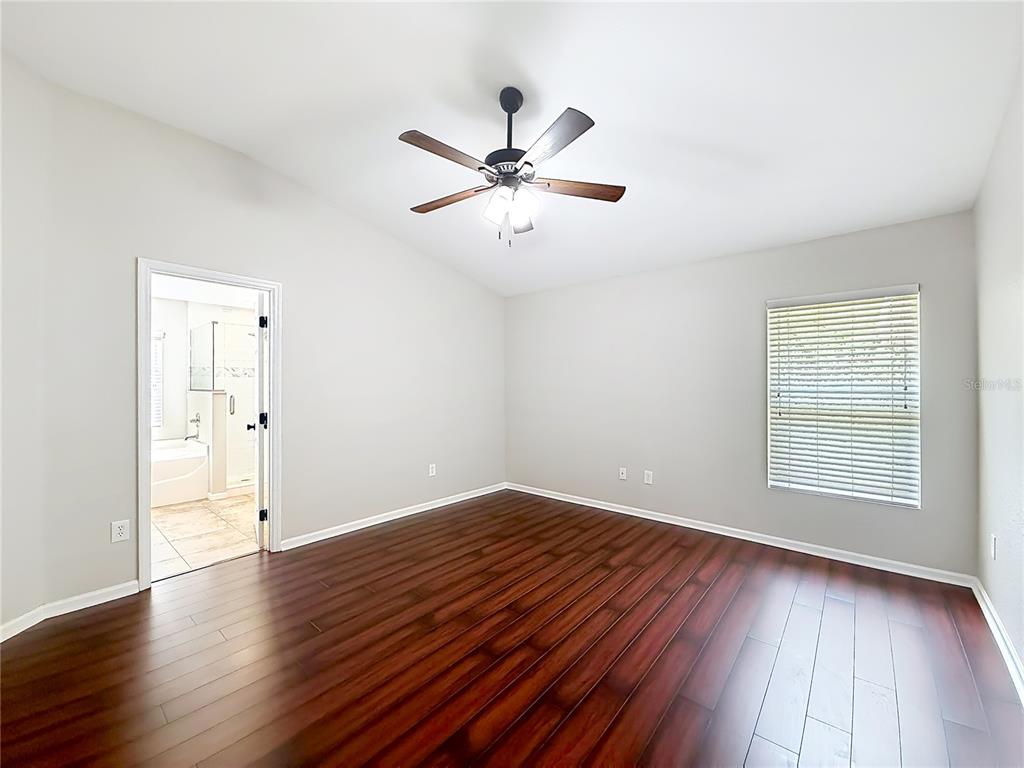 6358 Southwest 155th Place Ocala, FL 34473 - Photo 35 of 55 wooden floor in an empty room with a window