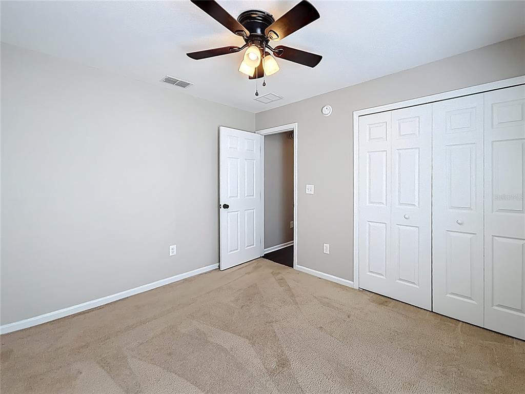 6358 Southwest 155th Place Ocala, FL 34473 - Photo 46 of 55 a view of an empty room and a ceiling fan
