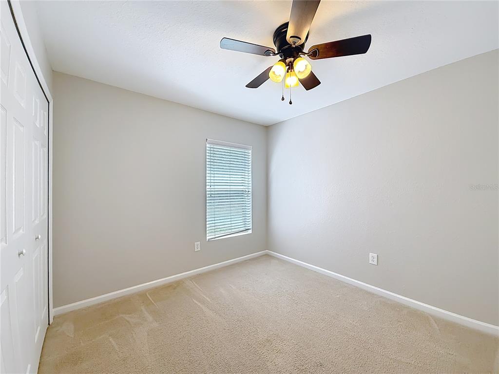 6358 Southwest 155th Place Ocala, FL 34473 - Photo 47 of 55 an empty room with a window