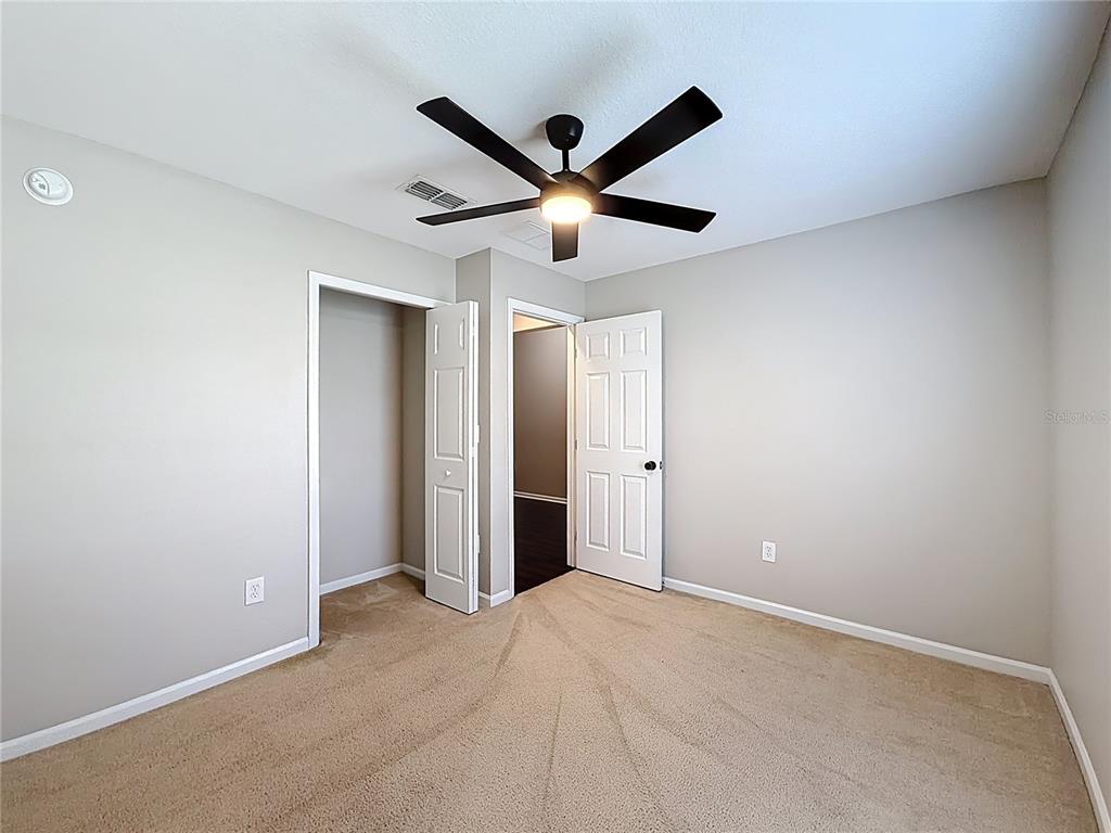 6358 Southwest 155th Place Ocala, FL 34473 - Photo 50 of 55 a view of a livingroom with a ceiling fan and a window
