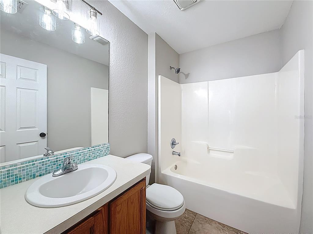 6358 Southwest 155th Place Ocala, FL 34473 - Photo 51 of 55 a bathroom with a sink and a mirror