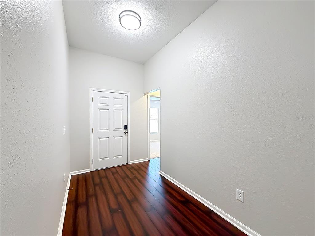 6358 Southwest 155th Place Ocala, FL 34473 - Photo 6 of 55 a view of room with window and wooden floor