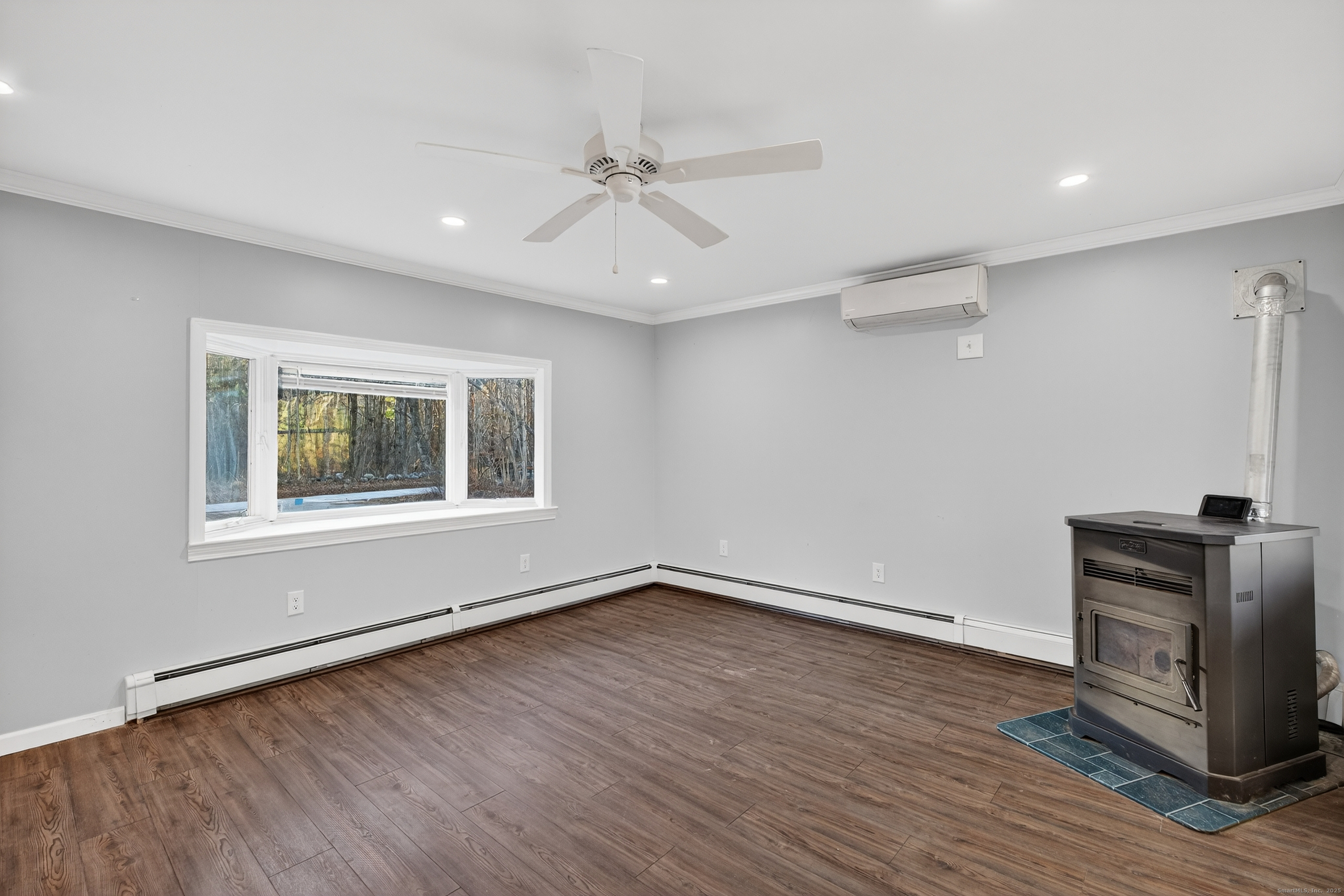 586 Back Road Windham, CT 06256 - Photo 11 of 32 a view of an empty room with a window and wooden floor
