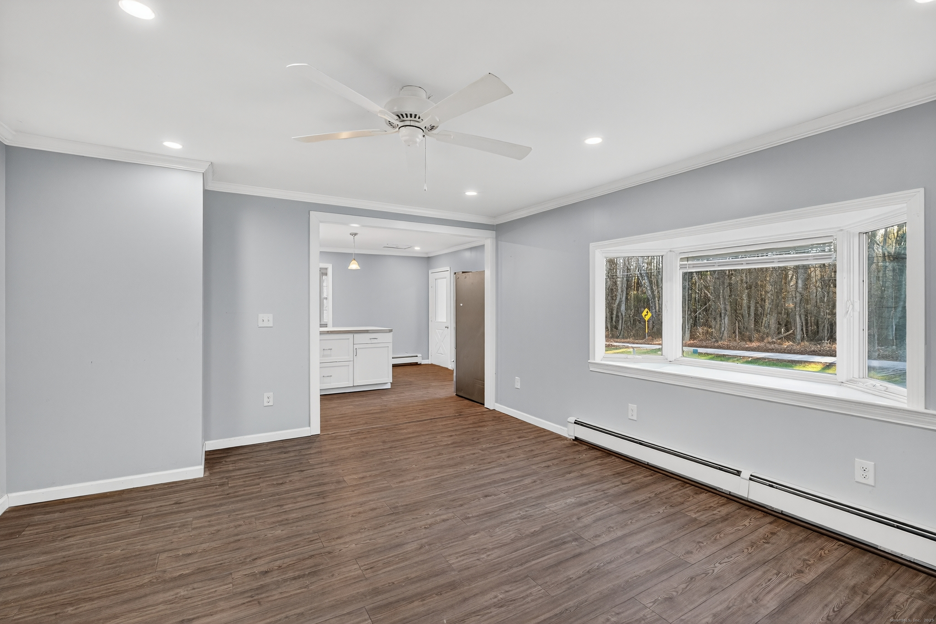 586 Back Road Windham, CT 06256 - Photo 12 of 32 a view of an empty room with a window and wooden floor