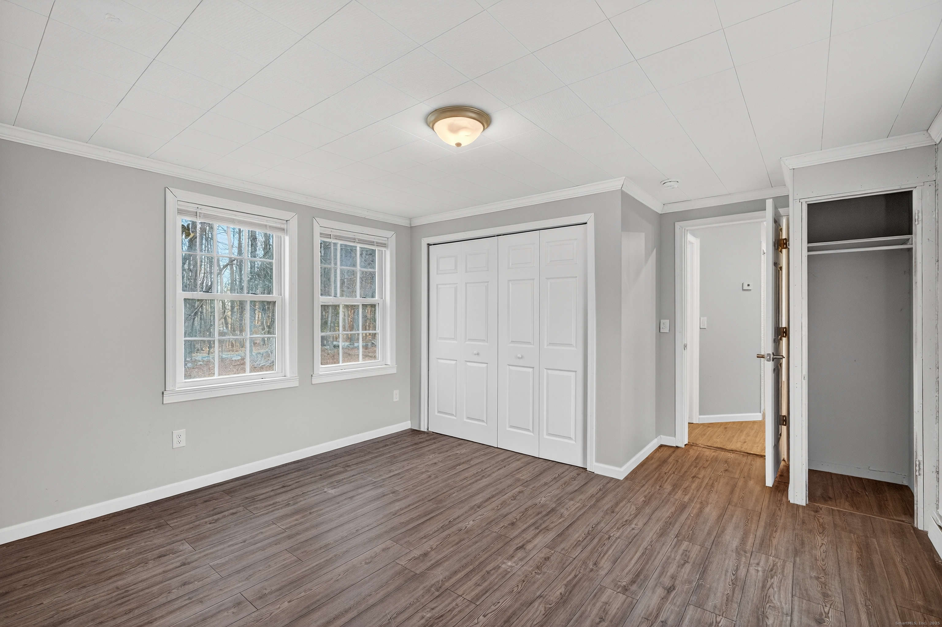 586 Back Road Windham, CT 06256 - Photo 20 of 32 a view of an empty room with wooden floor and a window