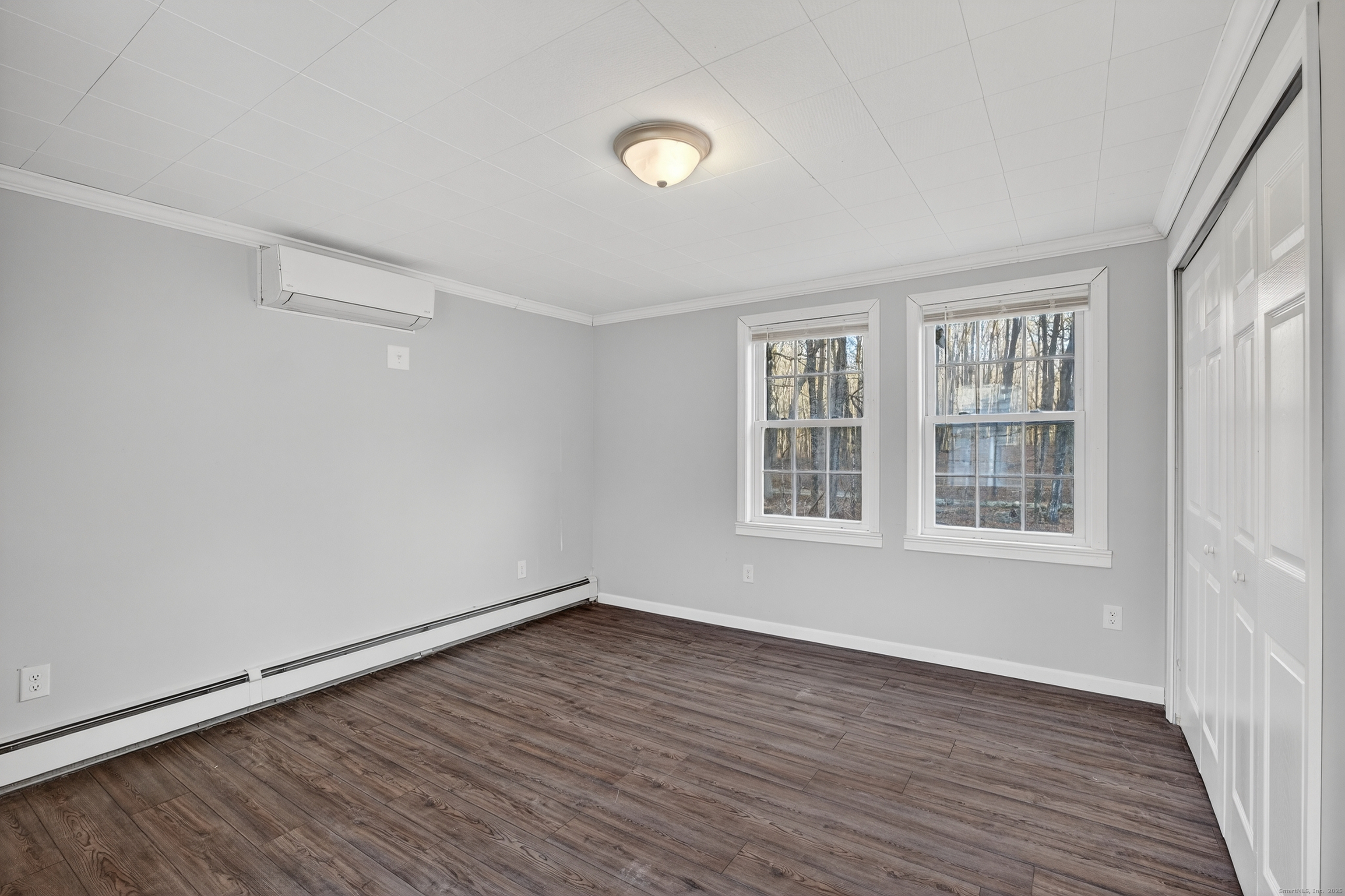 586 Back Road Windham, CT 06256 - Photo 21 of 32 a view of an empty room with wooden floor and a window