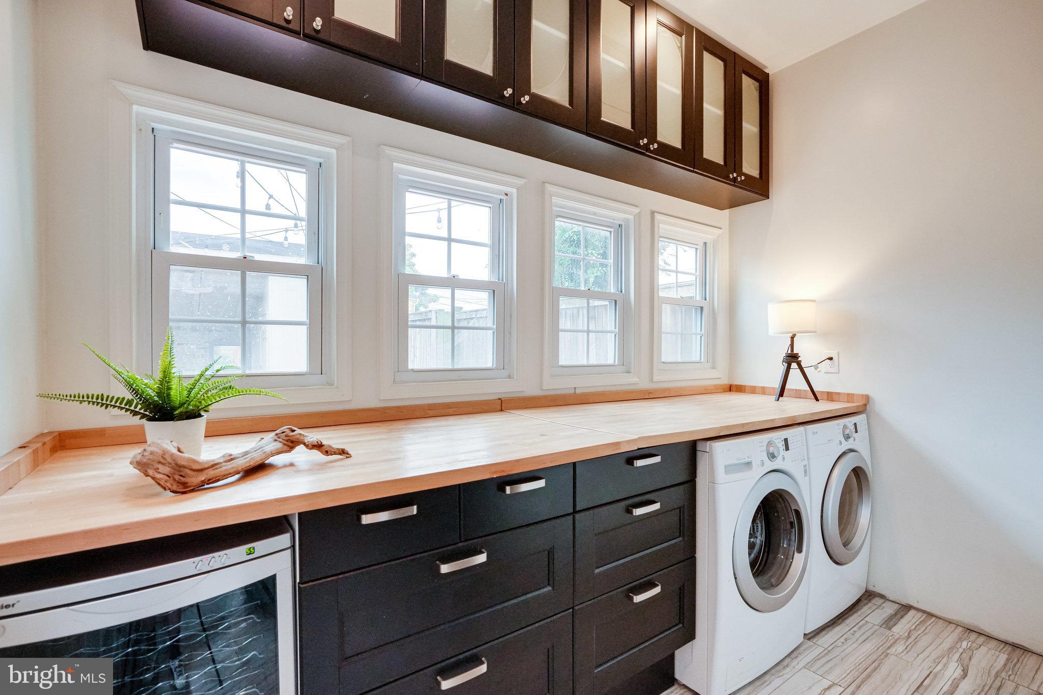 611 G Street Southeast Washington, DC 20003 - Photo 15 of 30 Mudroom with laundry, wine cooler and storage