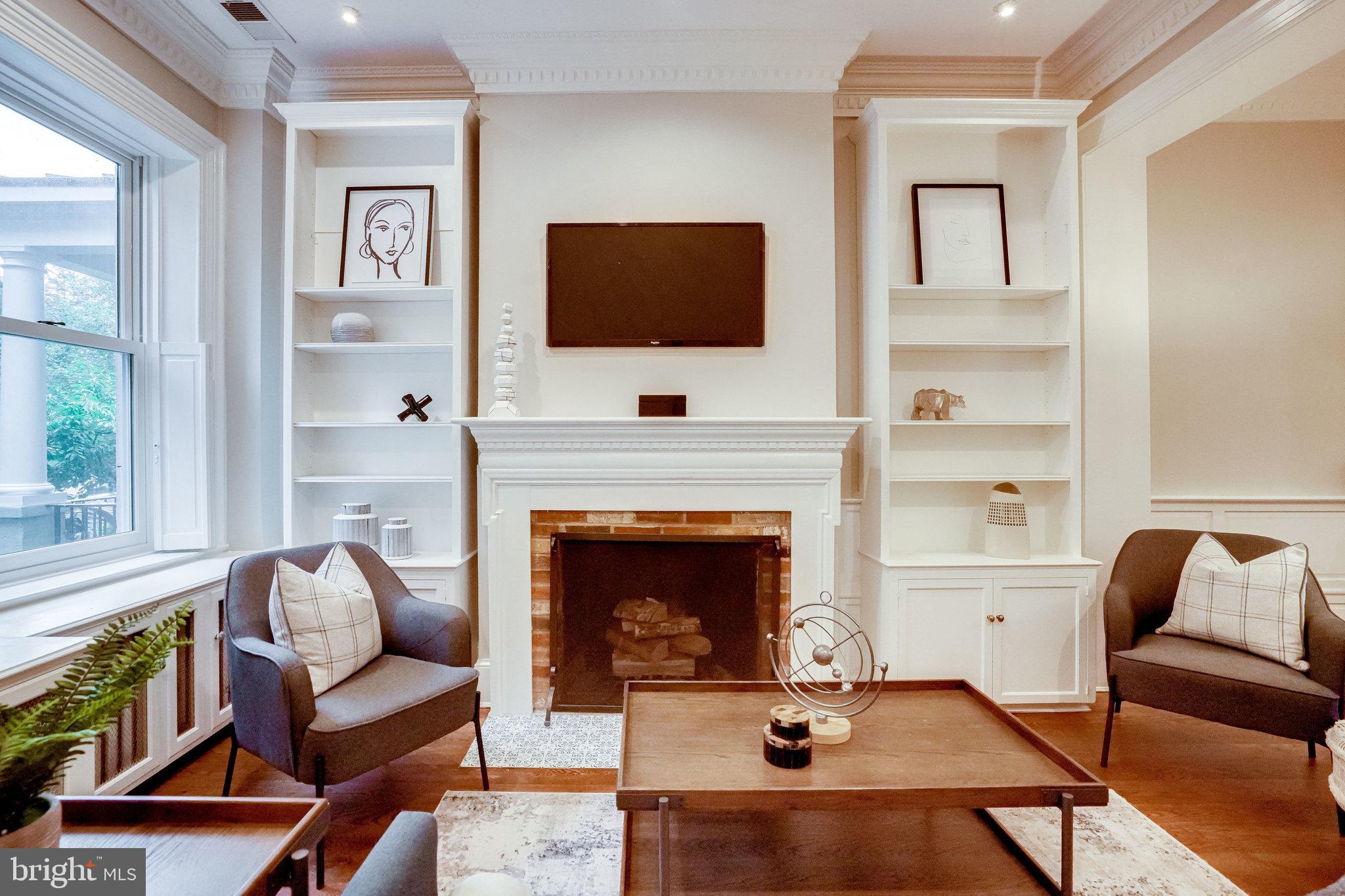 611 G Street Southeast Washington, DC 20003 - Photo 4 of 30 Ornate fireplace flanked by built-ins