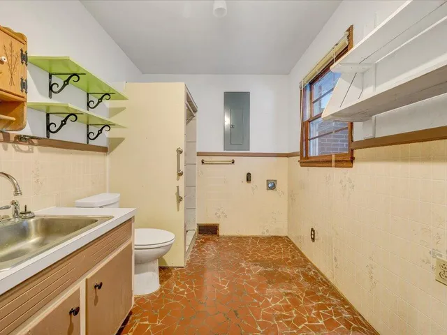 a bathroom with a sink and a toilet