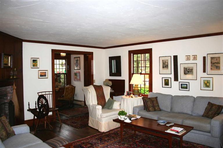 11 Sparrowhawk Road Orleans, MA 02653 - Photo 7 of 16 a living room with furniture and floor to ceiling windows