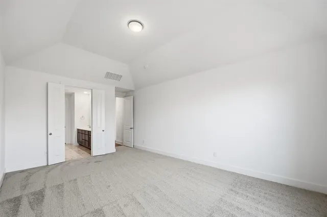 a view of an empty room and closet