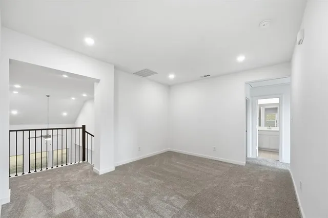 a view of a hallway with a bathroom