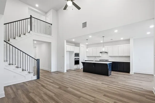 a view of kitchen and kitchen with wooden floor