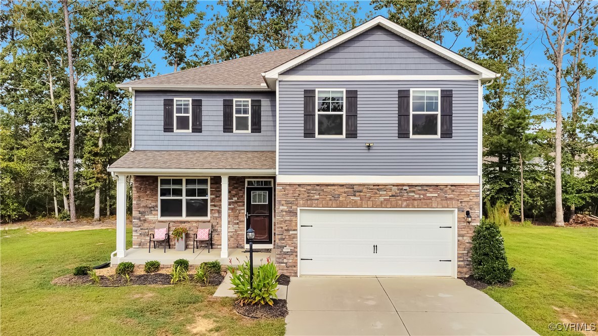 7232 Cress Terrace New Kent, VA 23124 - Photo 1 of 42 a front view of a house with garden