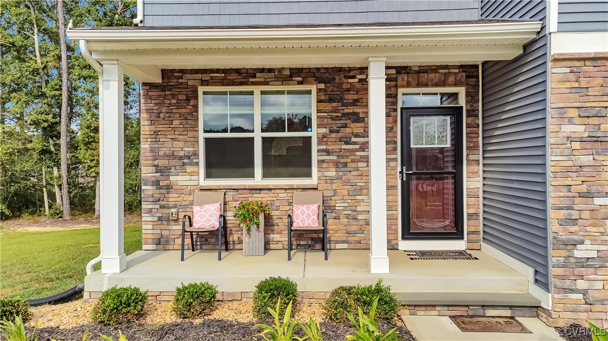 7232 Cress Terrace New Kent, VA 23124 - Photo 2 of 42 a view of front door of house with outdoor seating