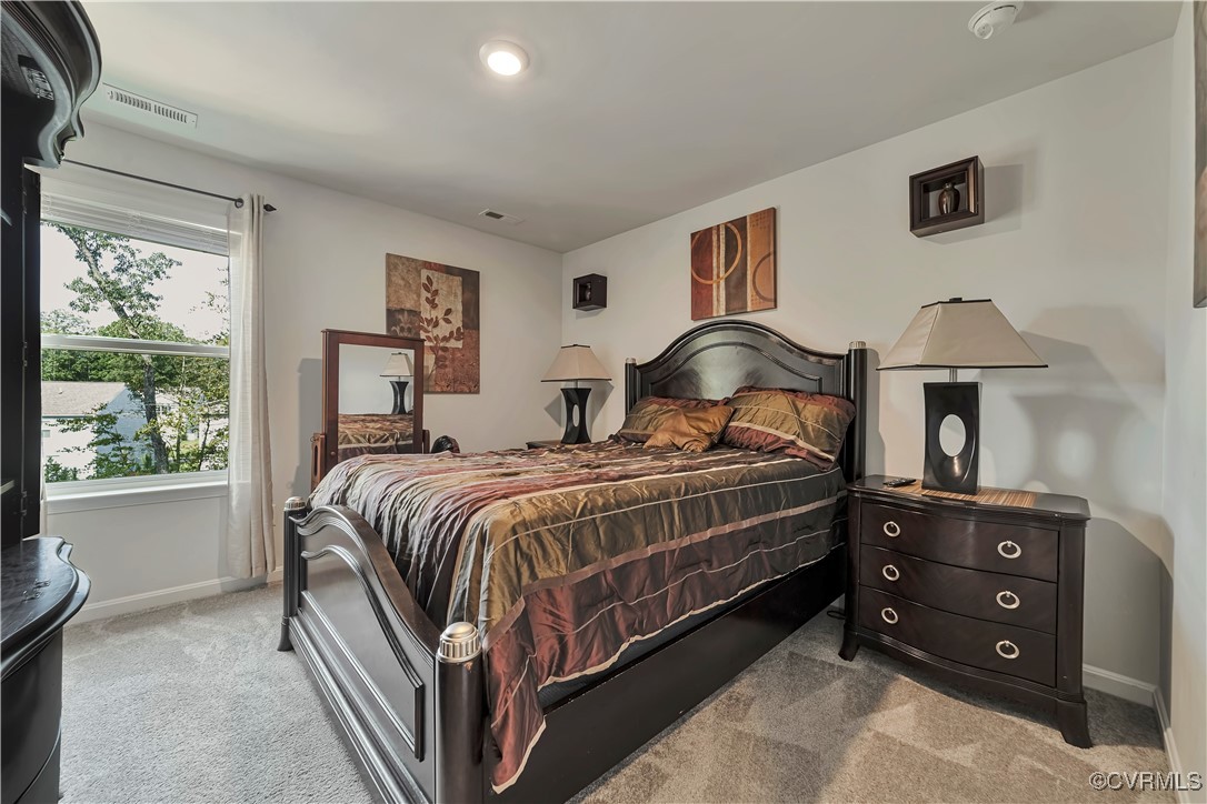 7232 Cress Terrace New Kent, VA 23124 - Photo 29 of 42 a bedroom with a bed and a lamp