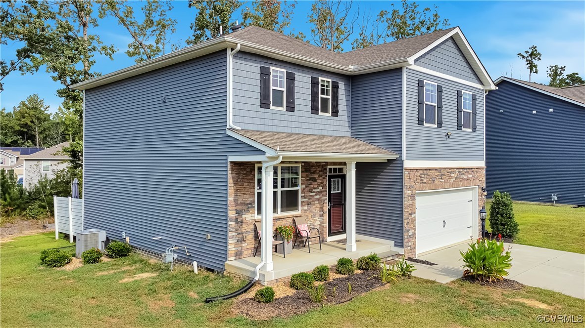 7232 Cress Terrace New Kent, VA 23124 - Photo 3 of 42 a front view of a house with garden