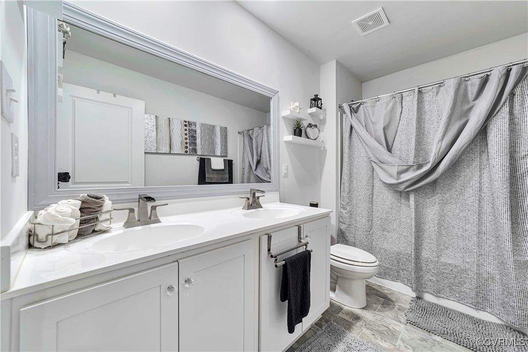 7232 Cress Terrace New Kent, VA 23124 - Photo 31 of 42 a bathroom with a sink toilet and shower