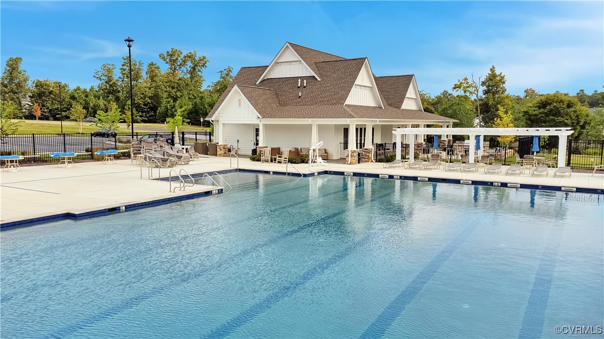 7232 Cress Terrace New Kent, VA 23124 - Photo 39 of 42 a view of a house with pool and chairs