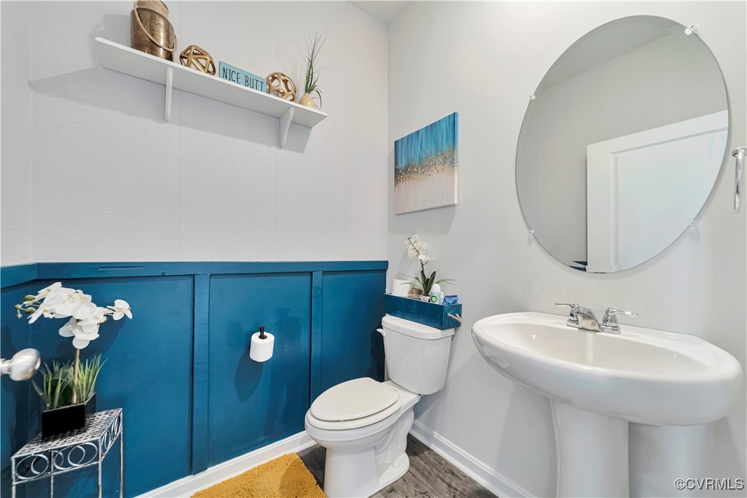 7232 Cress Terrace New Kent, VA 23124 - Photo 7 of 42 a bathroom with a toilet sink and mirror
