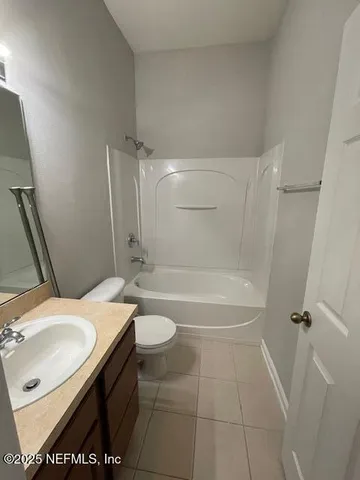a view of a bathroom from a hallway