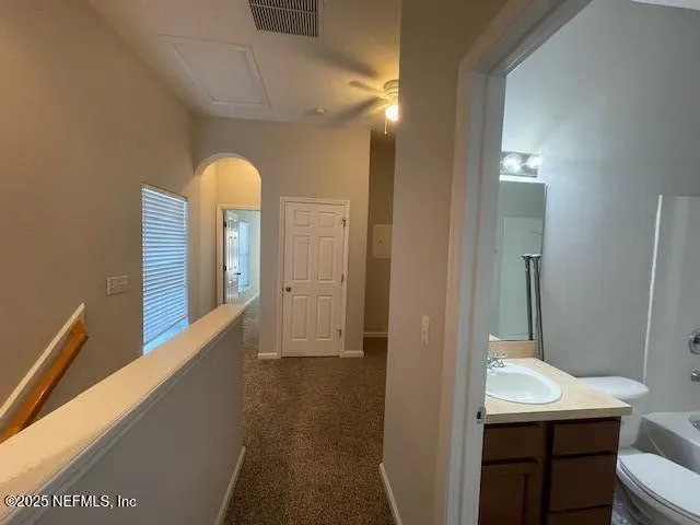 a view of a hallway with a window