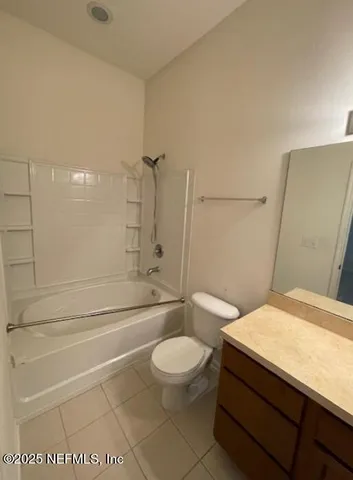 a view of house with sign board and yard