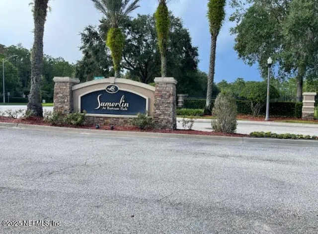 a view of a two chairs in a yard