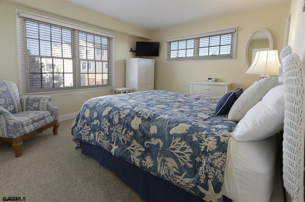205 West Brigantine Avenue Brigantine, NJ 08203 - Photo 12 of 31 a bed sitting in a bedroom next to a window