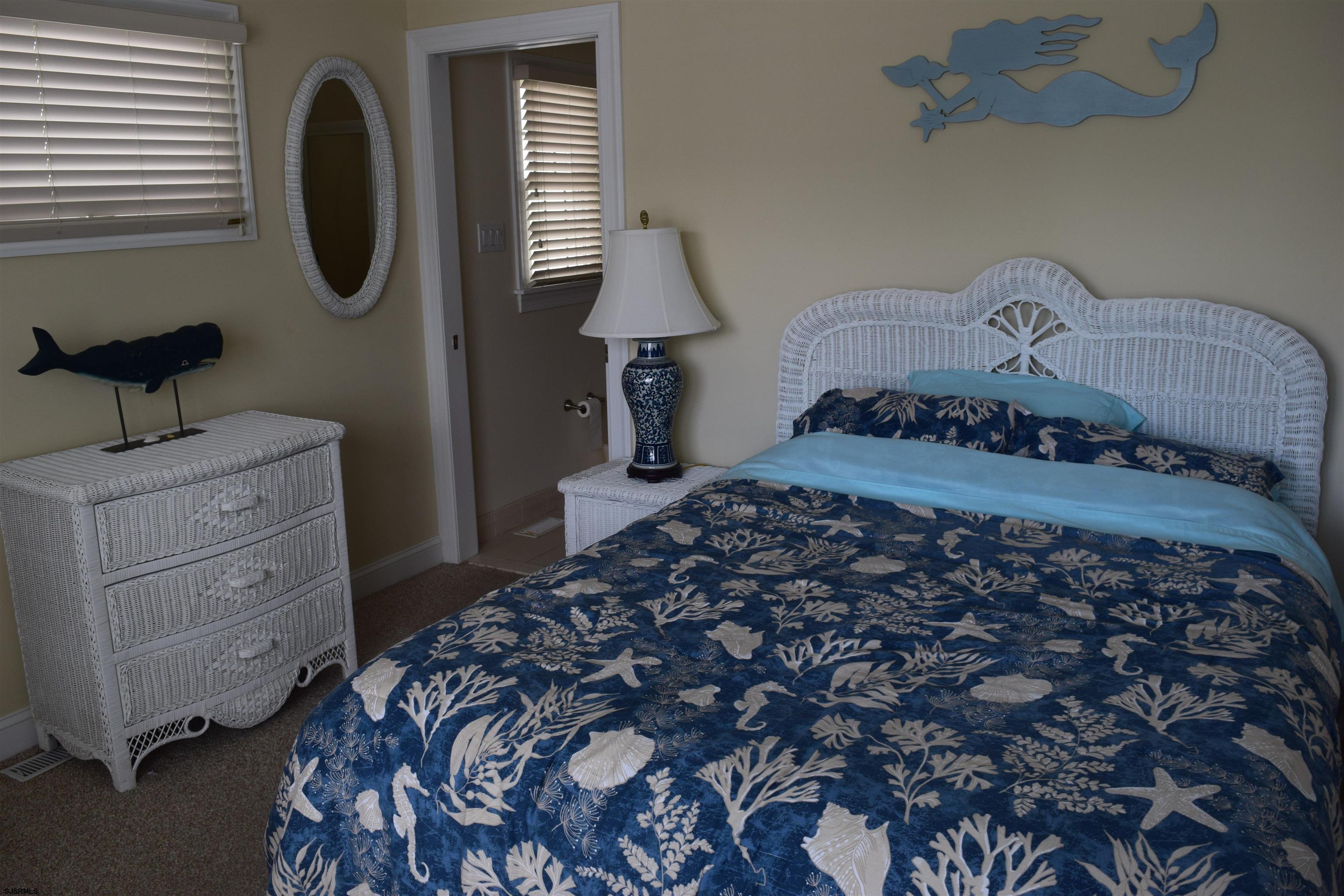 205 West Brigantine Avenue Brigantine, NJ 08203 - Photo 13 of 31 a bedroom with a bed and a dresser