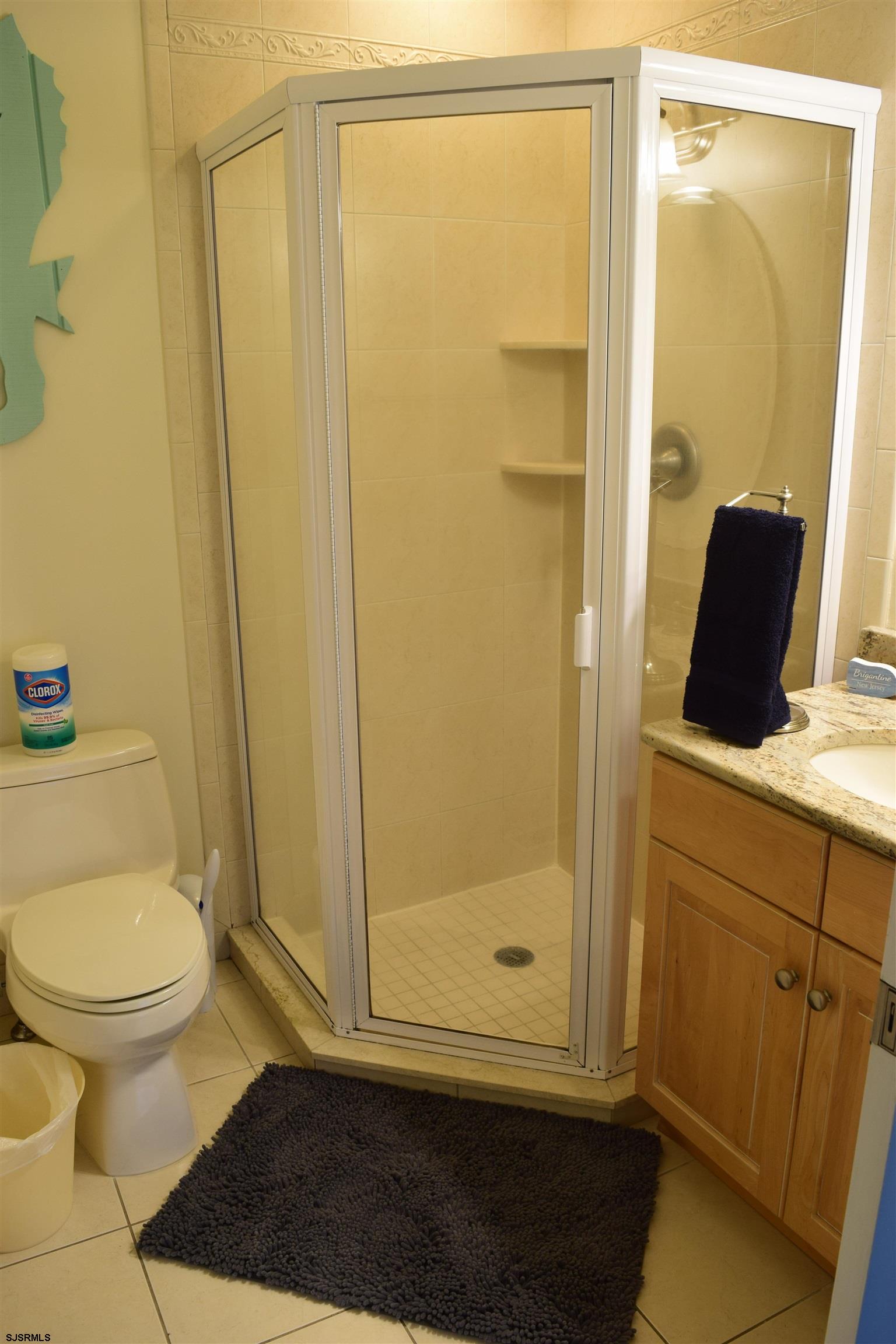 205 West Brigantine Avenue Brigantine, NJ 08203 - Photo 14 of 31 a bathroom with a sink and a mirror