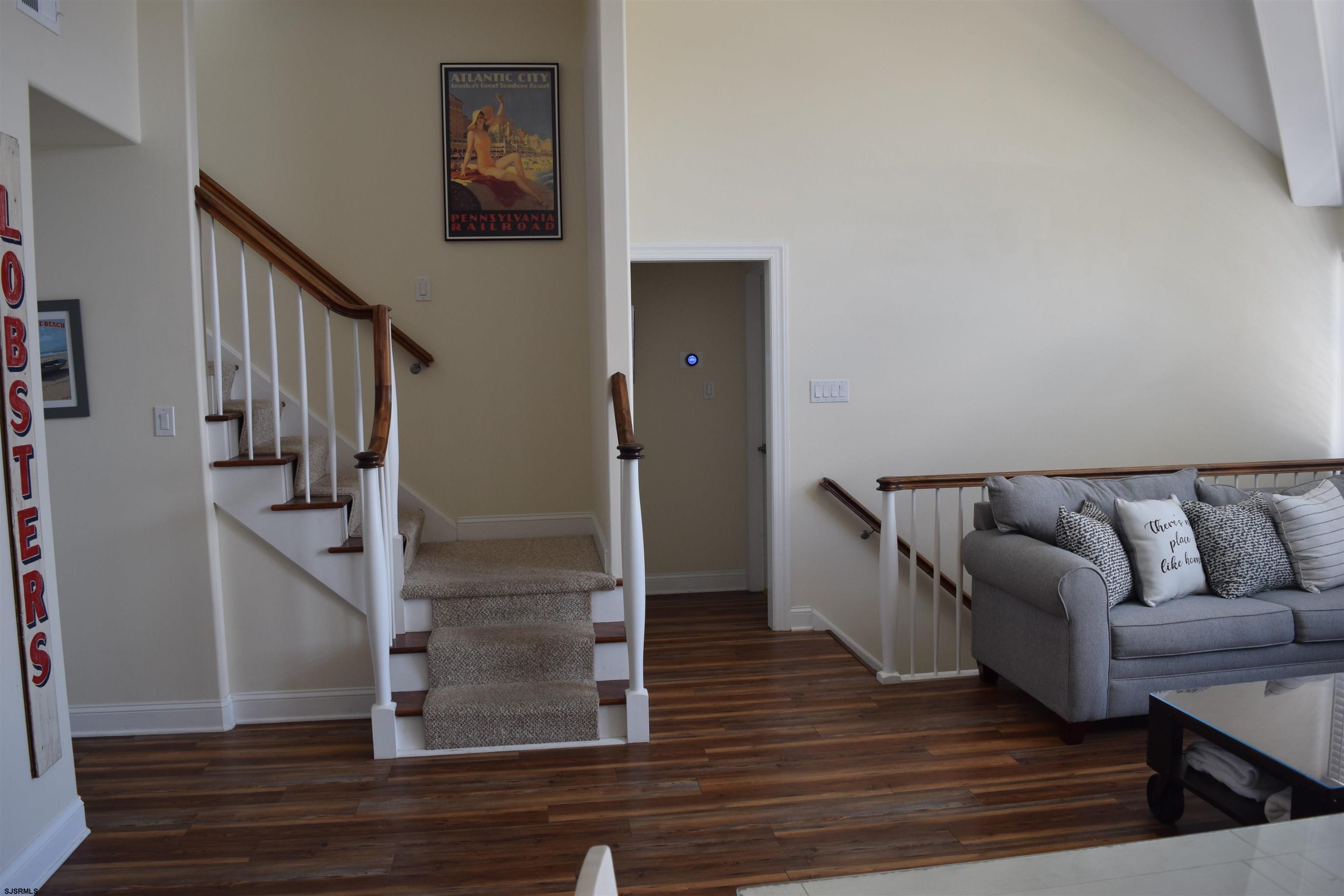 205 West Brigantine Avenue Brigantine, NJ 08203 - Photo 18 of 31 a living room with furniture and a wooden floor
