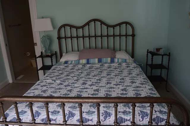 a white toilet sitting next to a bathroom sink and tub