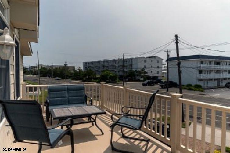 205 West Brigantine Avenue Brigantine, NJ 08203 - Photo 28 of 31 a view of a roof deck with couches and wooden floor