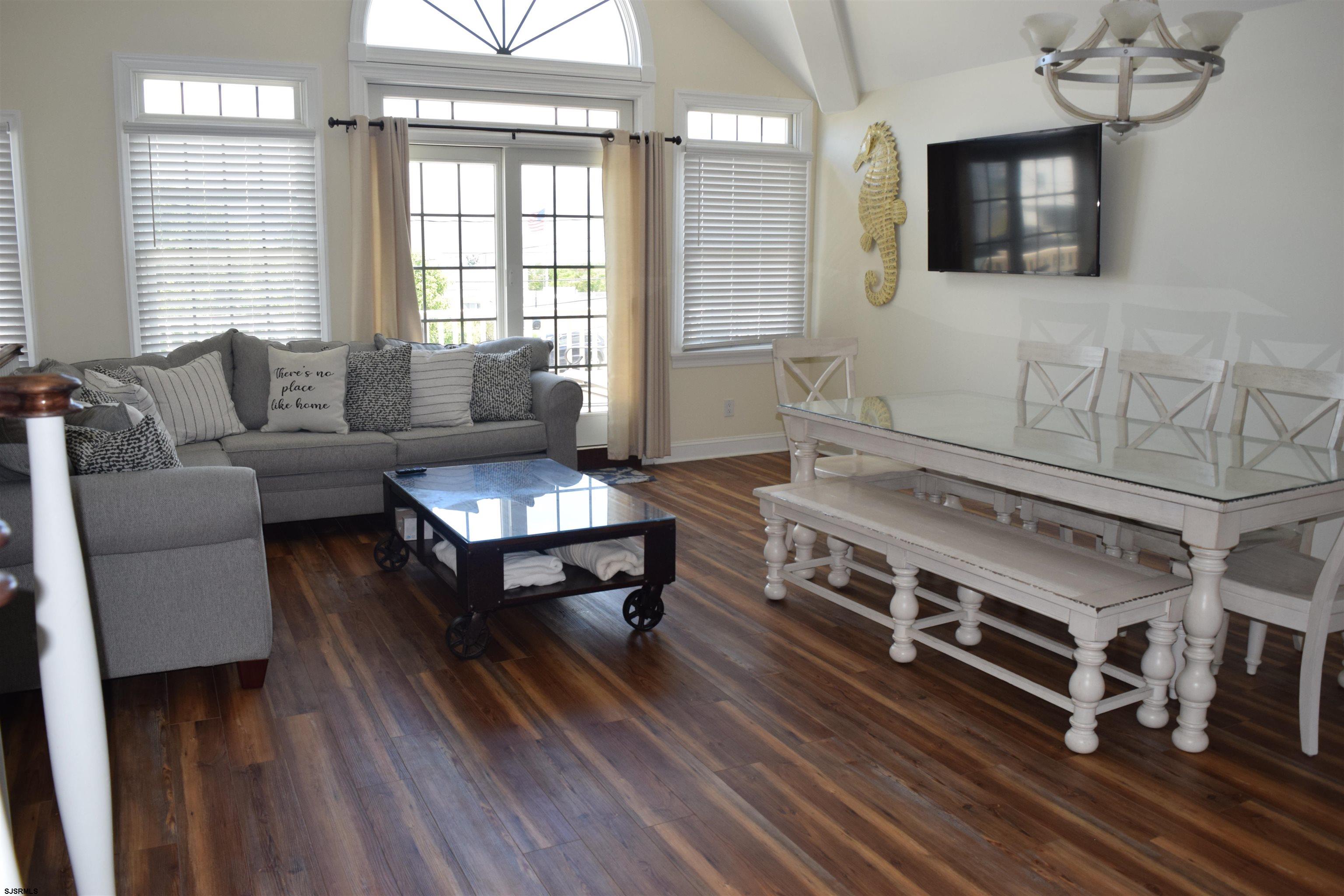 205 West Brigantine Avenue Brigantine, NJ 08203 - Photo 5 of 31 a living room with furniture and a fireplace