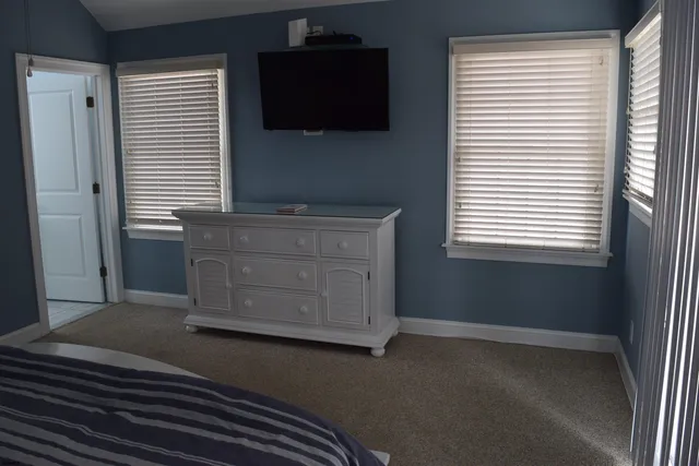 a kitchen with a wooden floor and a window