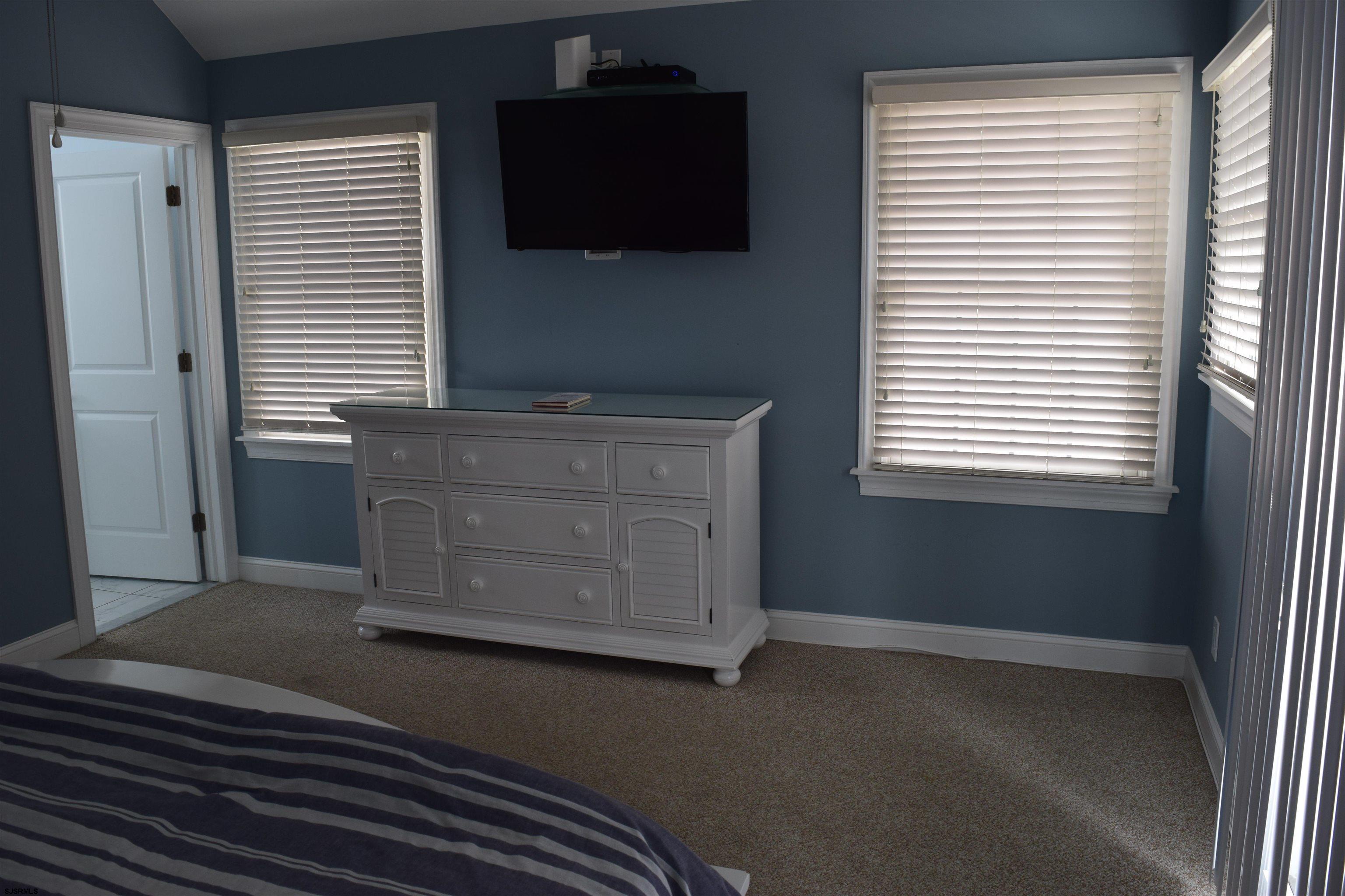 205 West Brigantine Avenue Brigantine, NJ 08203 - Photo 9 of 31 a kitchen with a wooden floor and a window