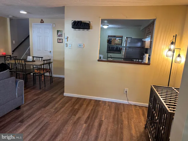 a view of a livingroom with furniture and wooden floor