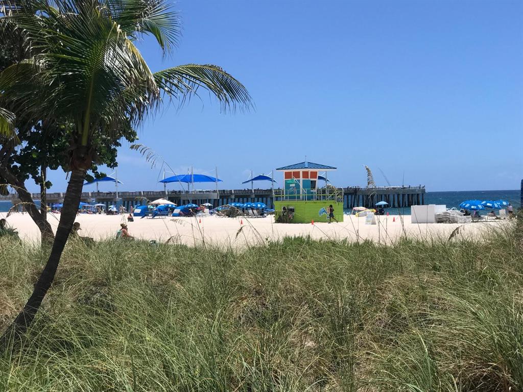 1110 North Riverside Drive, Unit 29 Pompano Beach, FL 33062 - Photo 1 of 17 a backyard of a house with lots of green space