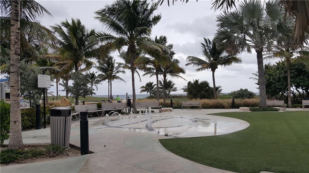 1110 North Riverside Drive, Unit 29 Pompano Beach, FL 33062 - Photo 13 of 17 a view of a swimming pool with an outdoor space and seating area