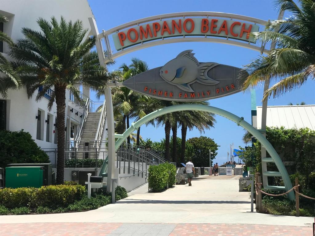 1110 North Riverside Drive, Unit 29 Pompano Beach, FL 33062 - Photo 16 of 17 a front view of a house with garden