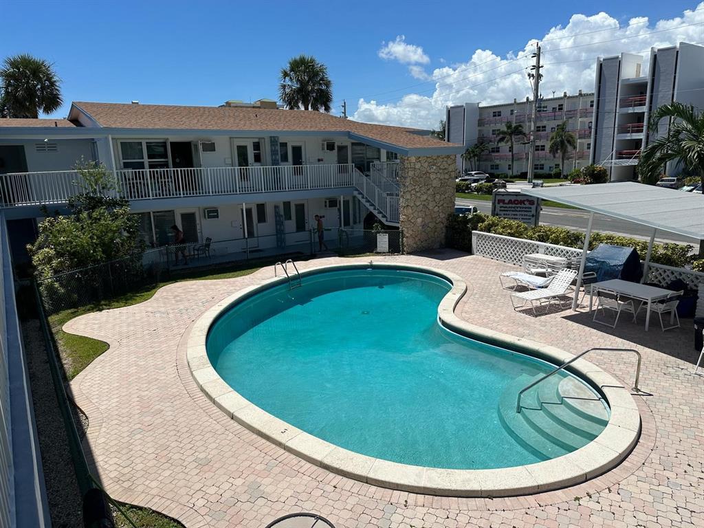1110 North Riverside Drive, Unit 29 Pompano Beach, FL 33062 - Photo 4 of 17 a view of a house with swimming pool