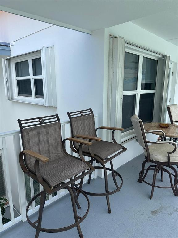 1110 North Riverside Drive, Unit 29 Pompano Beach, FL 33062 - Photo 6 of 17 a view of a workspace with furniture and a chair