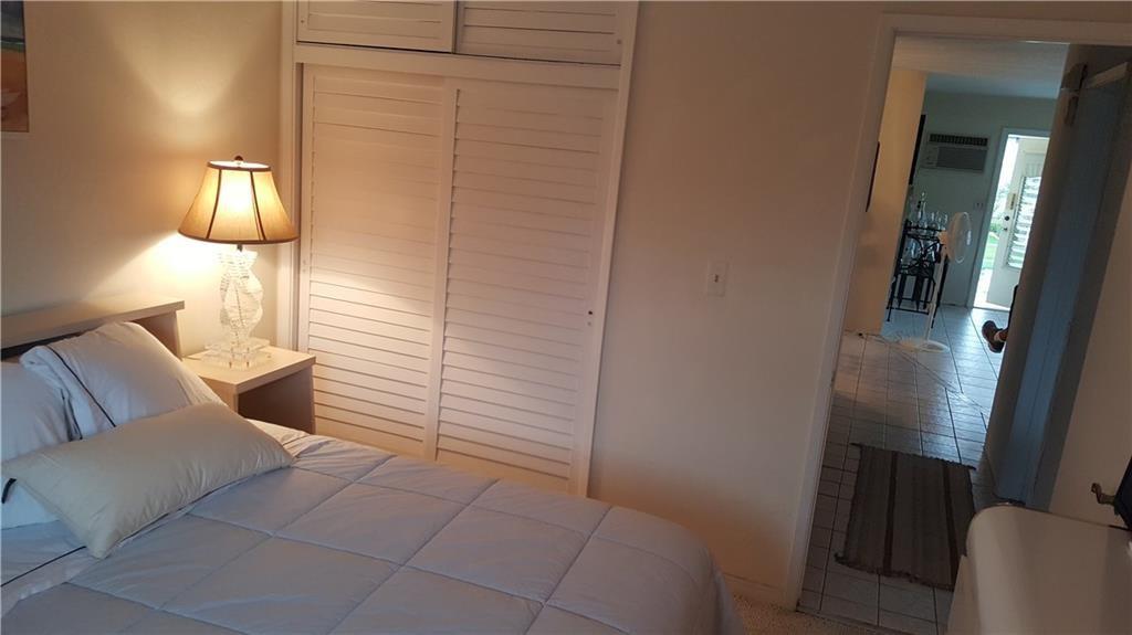 1110 North Riverside Drive, Unit 29 Pompano Beach, FL 33062 - Photo 7 of 17 a bathroom with a toilet and a mirror