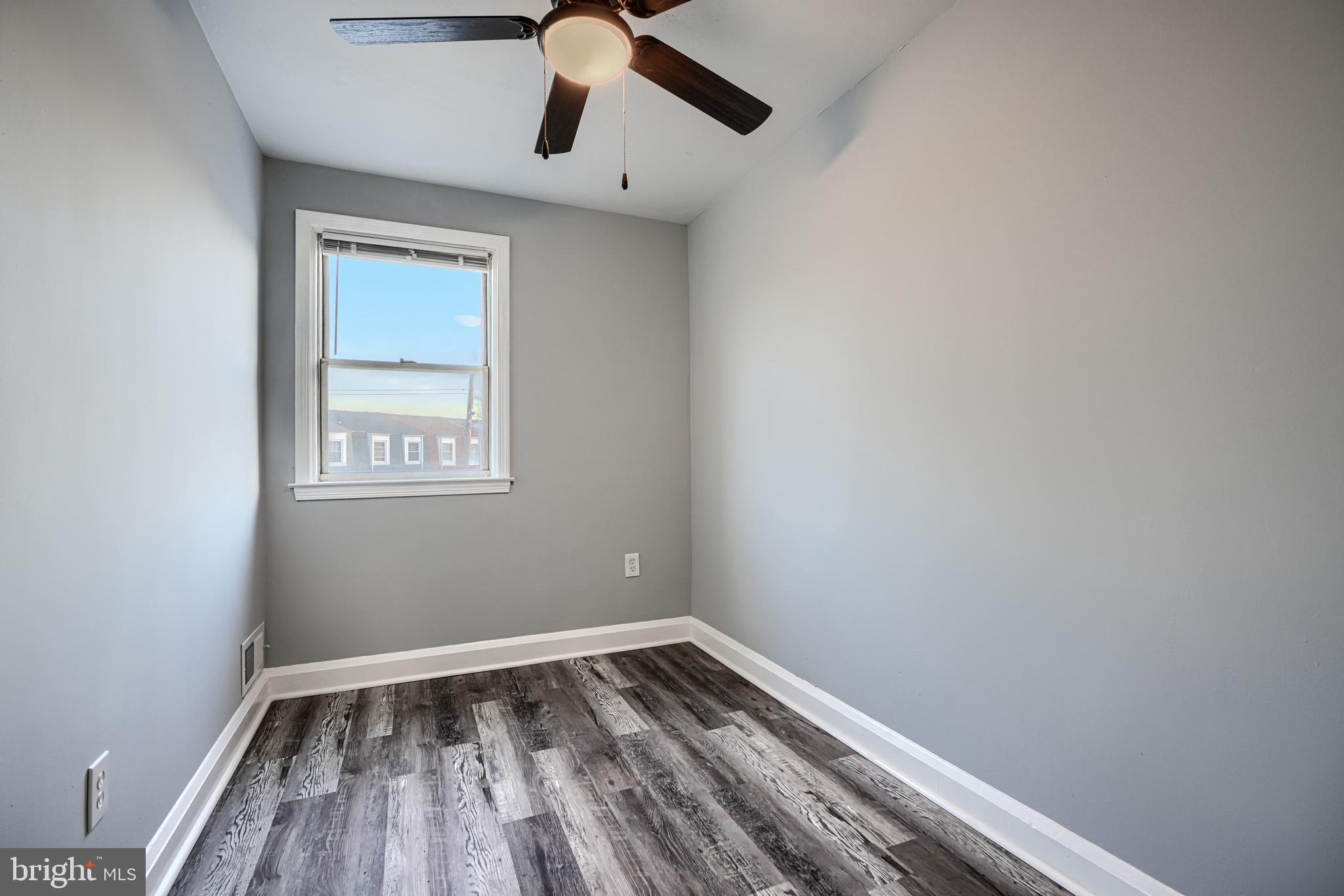 2123 Graythorn Road Middle River, MD 21220 - Photo 14 of 29 an empty room with a window and wooden floor